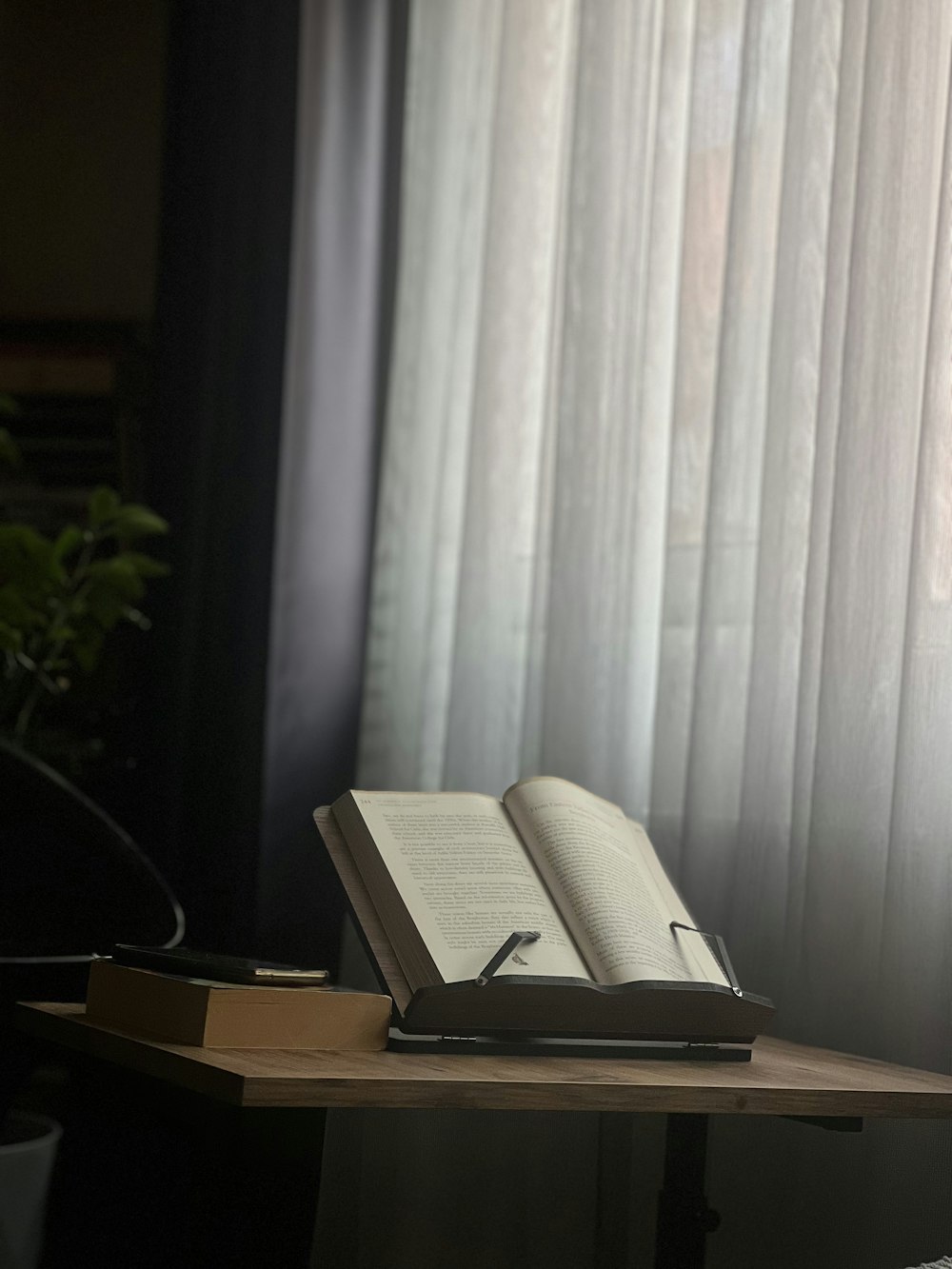 an open book sitting on top of a wooden table