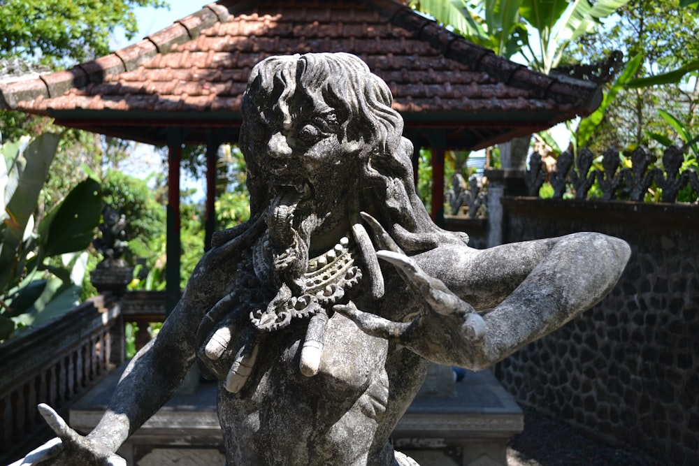 a statue of a man with a chain around his neck