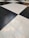 A floor composed of large black and white tiles arranged in a classic checkerboard pattern.