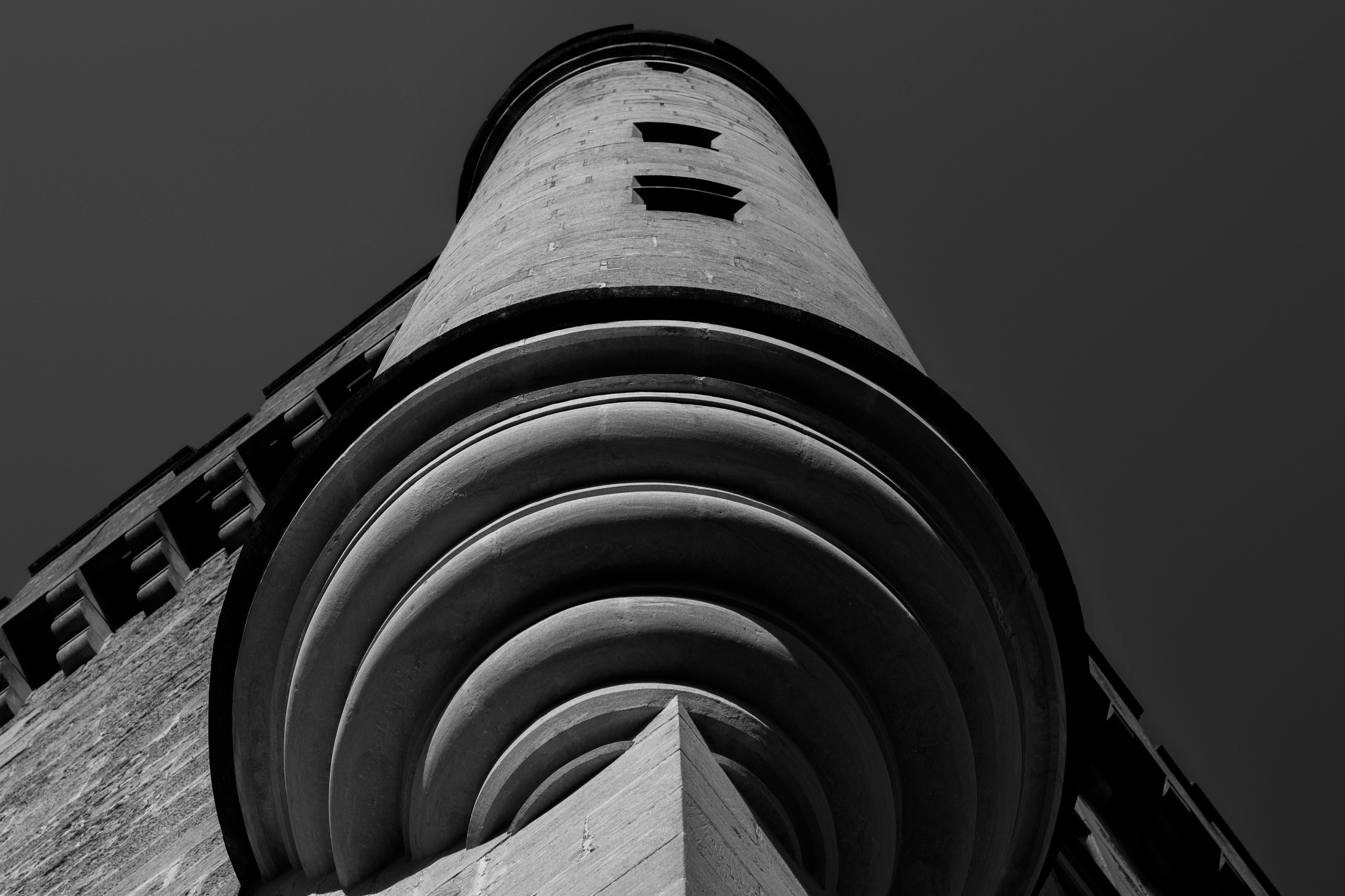 a black and white photo of a tall tower