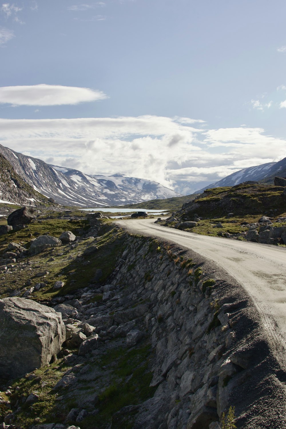 a dirt road in the middle of a mountain range