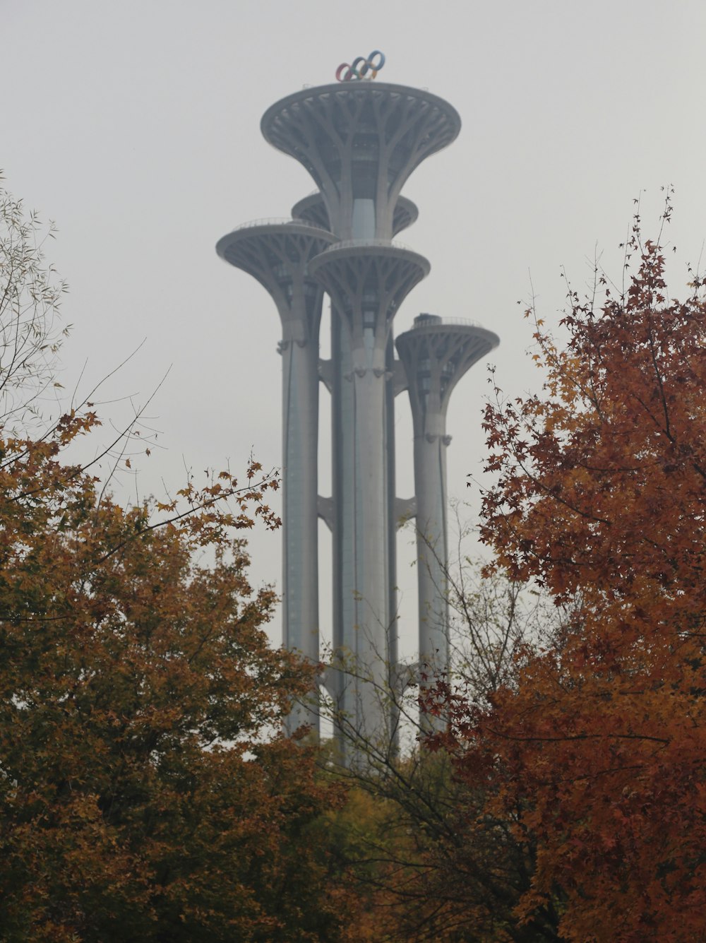 a tall tower with two rings on top of it