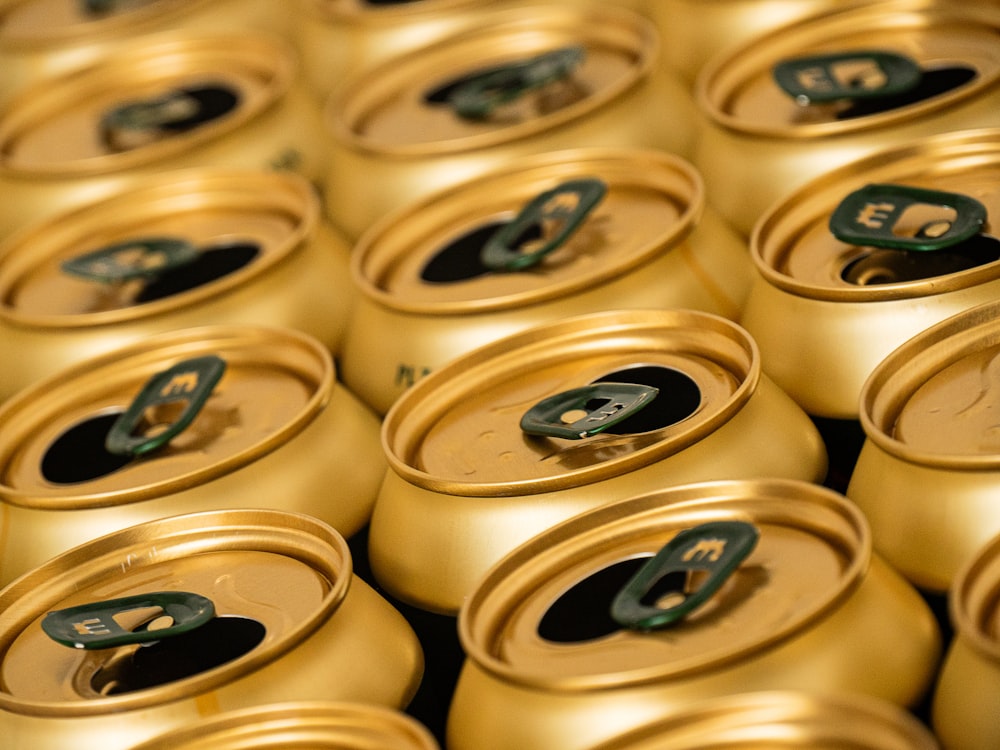 a close up of many cans of beer