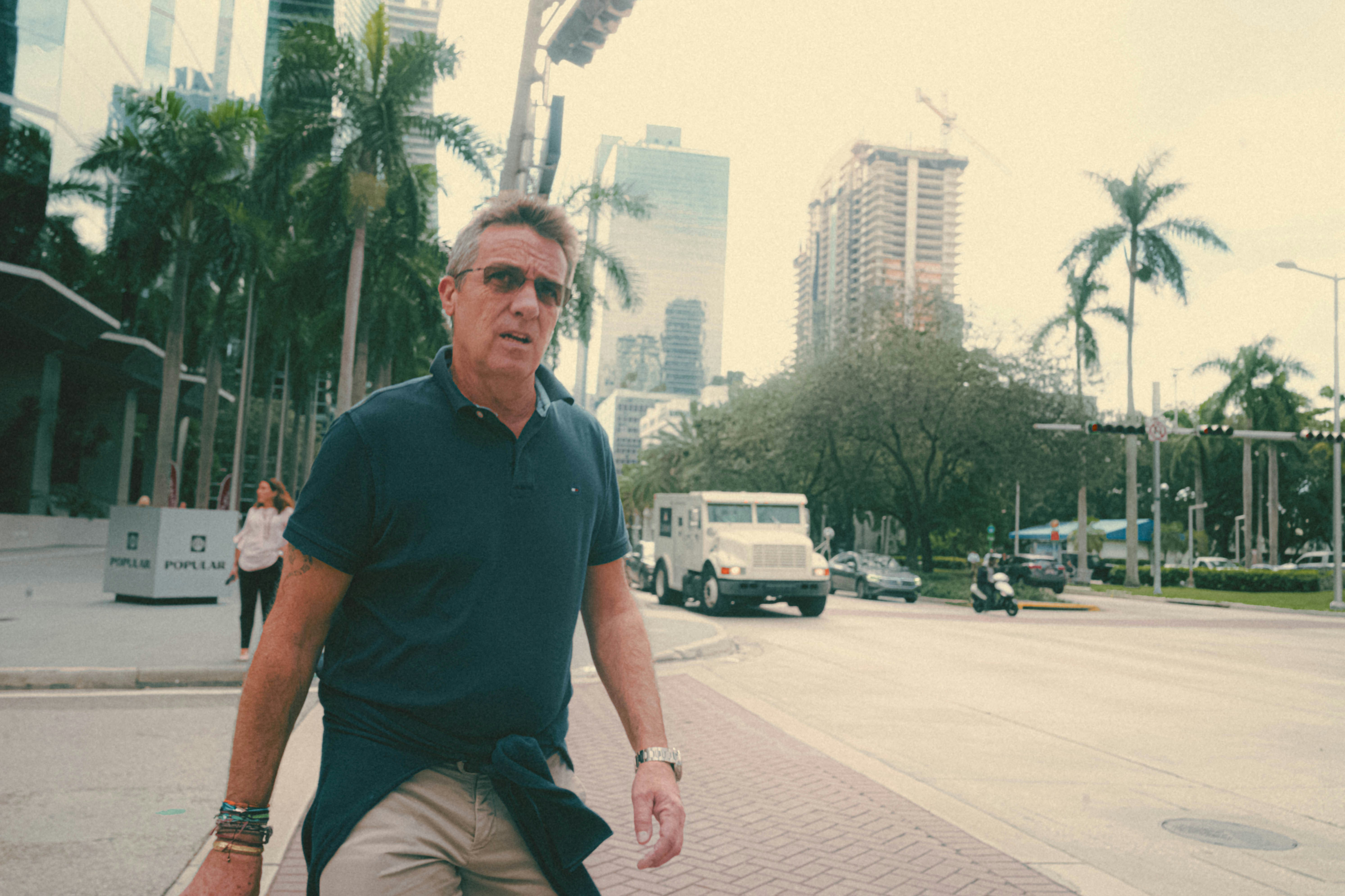 a man riding a skateboard down a street