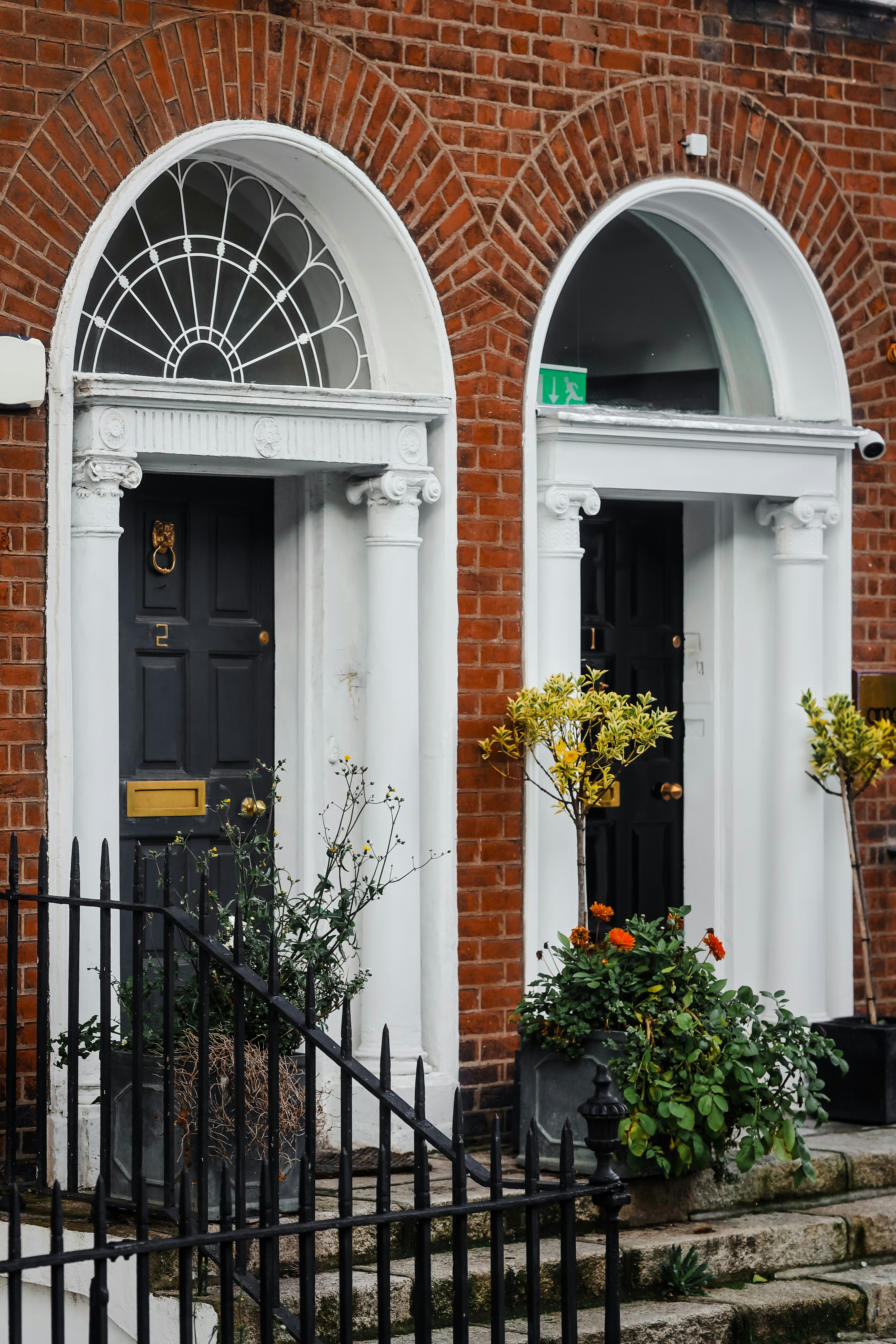 a couple of black doors sitting next to each other