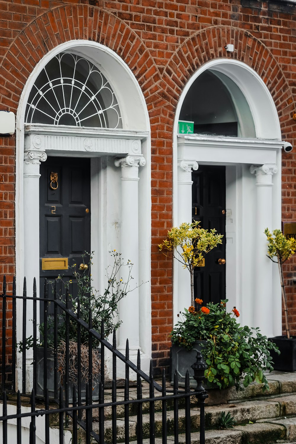 a couple of black doors sitting next to each other