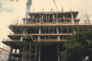 On-site photo of a redevelopment project showing construction progress and workers.