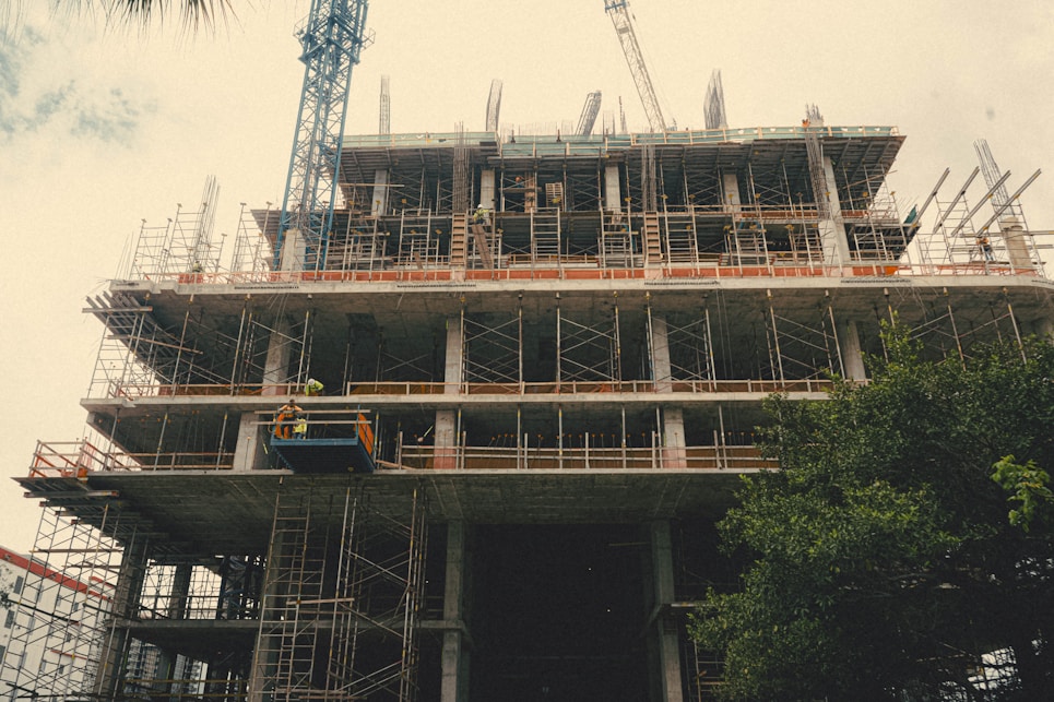A construction site showcasing workers collaborating on a building project.
