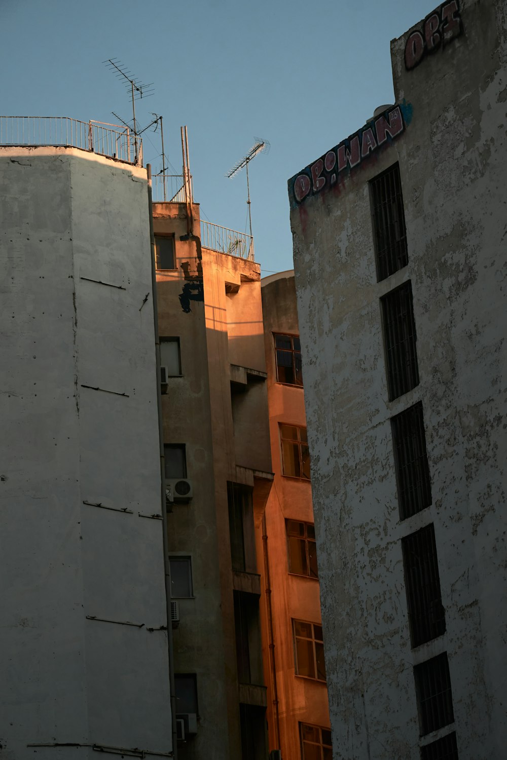 a couple of tall buildings next to each other