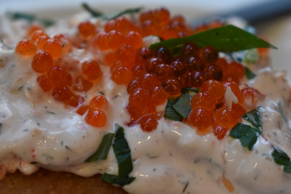 a close up of a plate of food with toppings