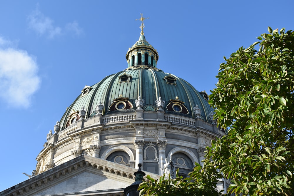 a dome on top of a building with a cross on top