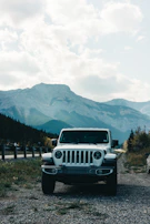A spacious family SUV parked near a mountain trail, perfect for adventure.