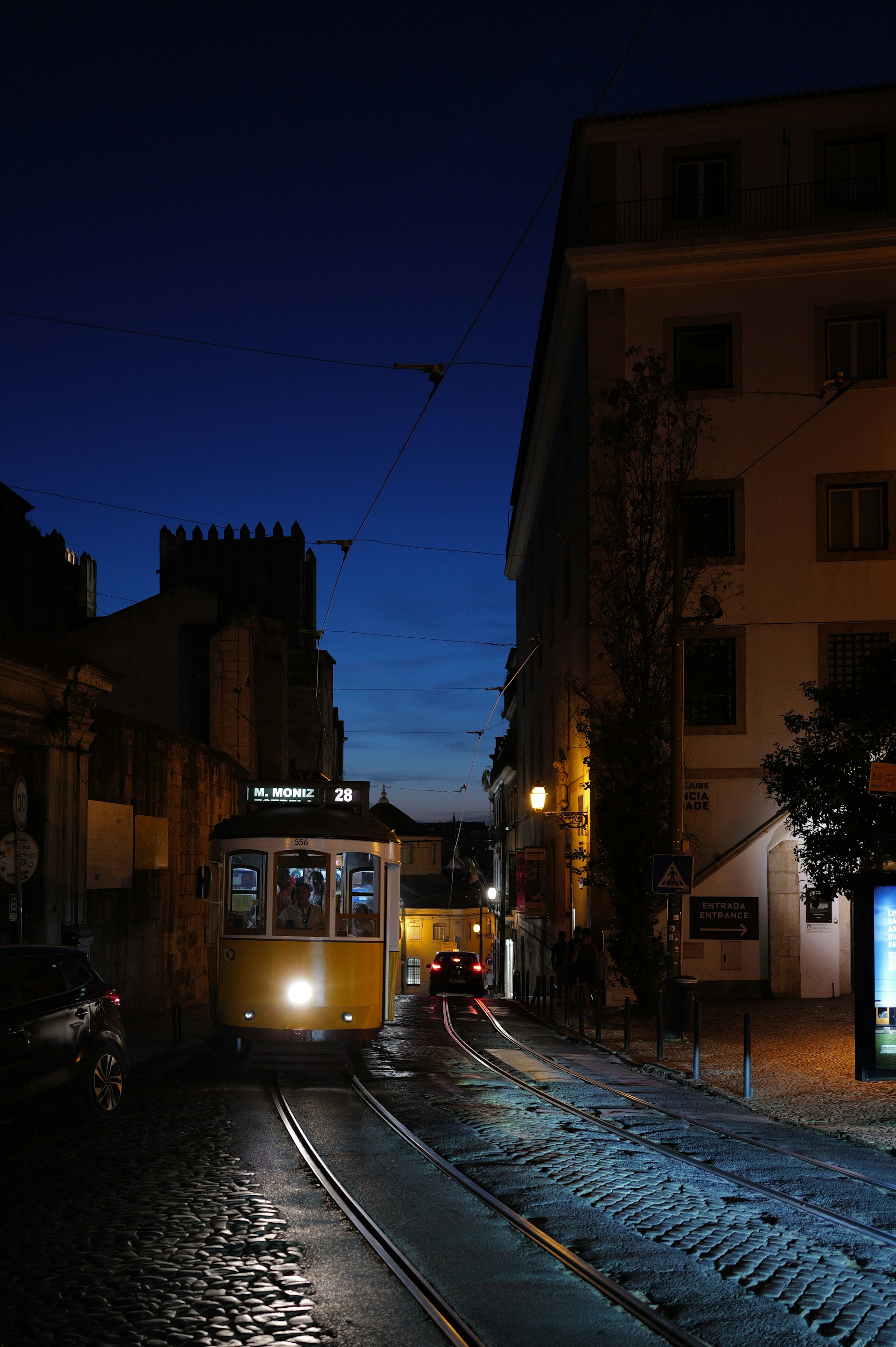woman wearing yellow long-sleeved dress under white clouds and blue sky during daytime
