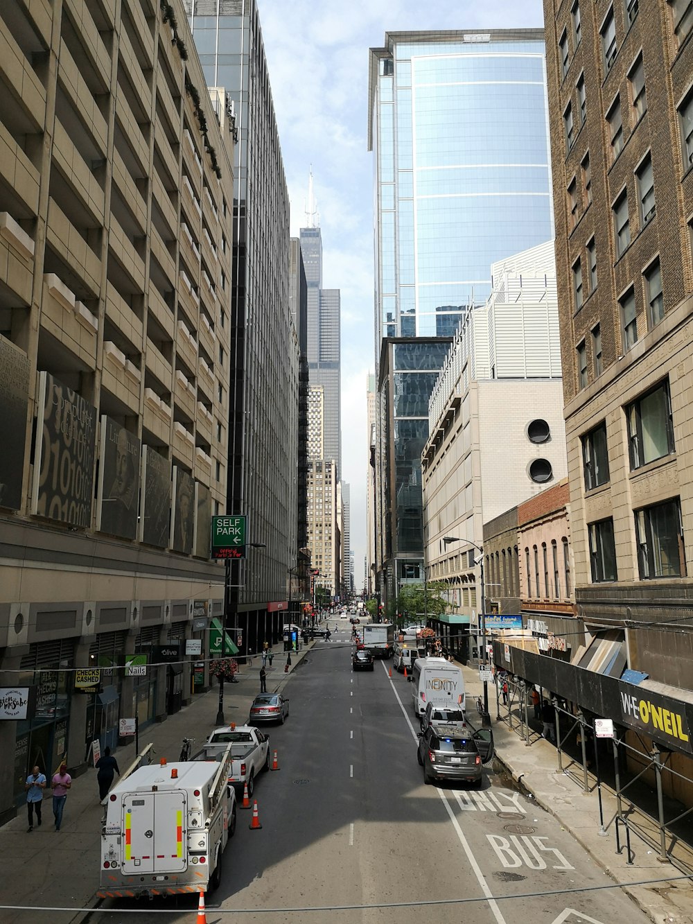 a city street filled with lots of tall buildings