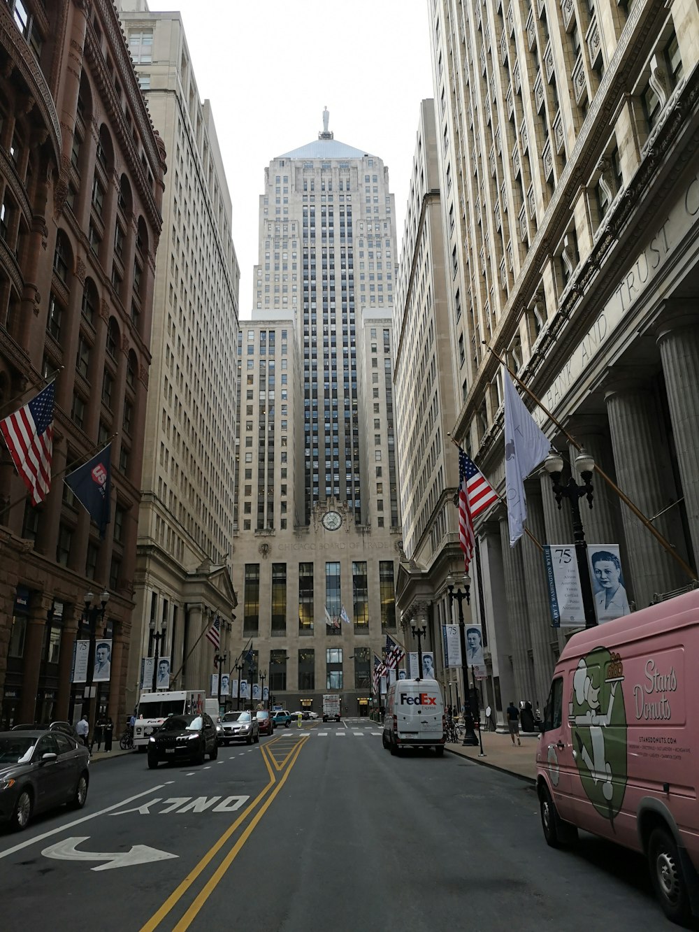 a city street filled with lots of tall buildings