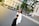 A stylish woman wearing a chic outfit in an urban setting.