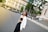 A stylish woman wearing a chic outfit in an urban setting.