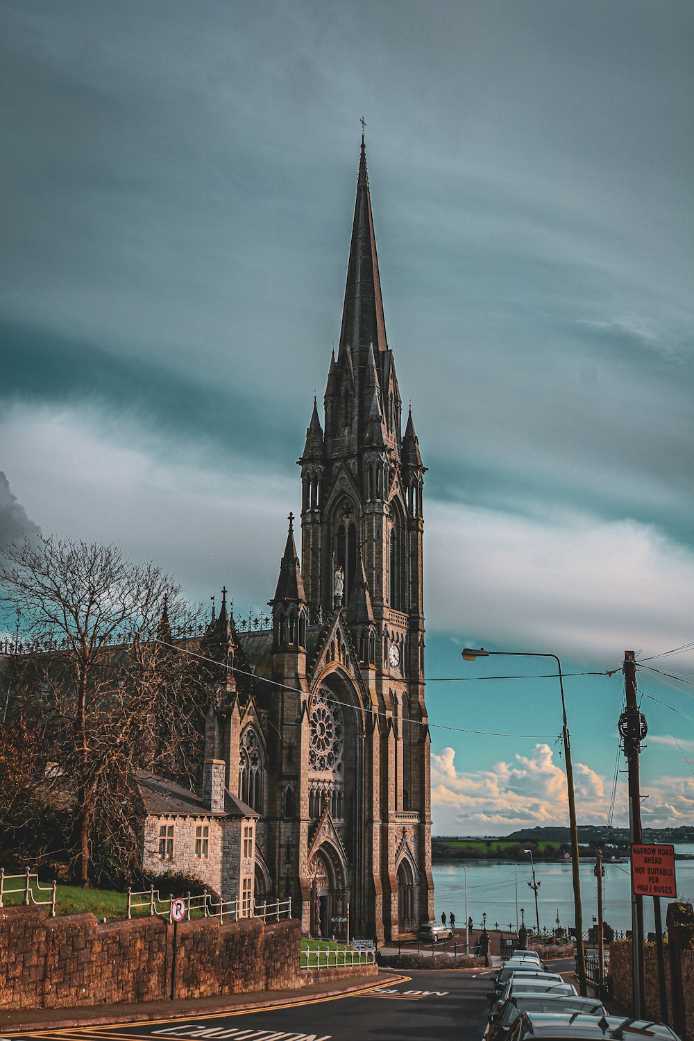 a large cathedral with a steeple on a cloudy day