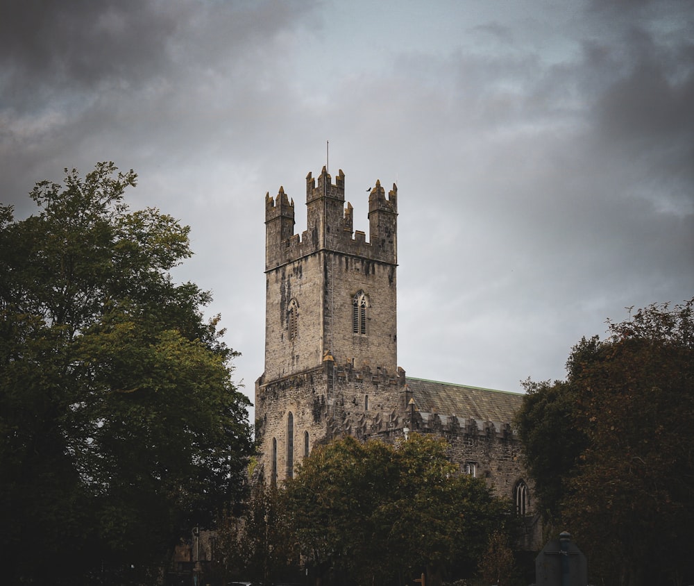 a tall tower with a clock on the top of it