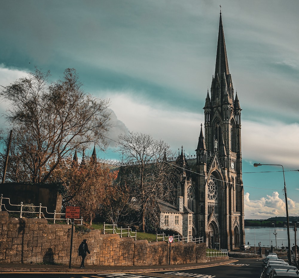 a large church with a steeple on a cloudy day