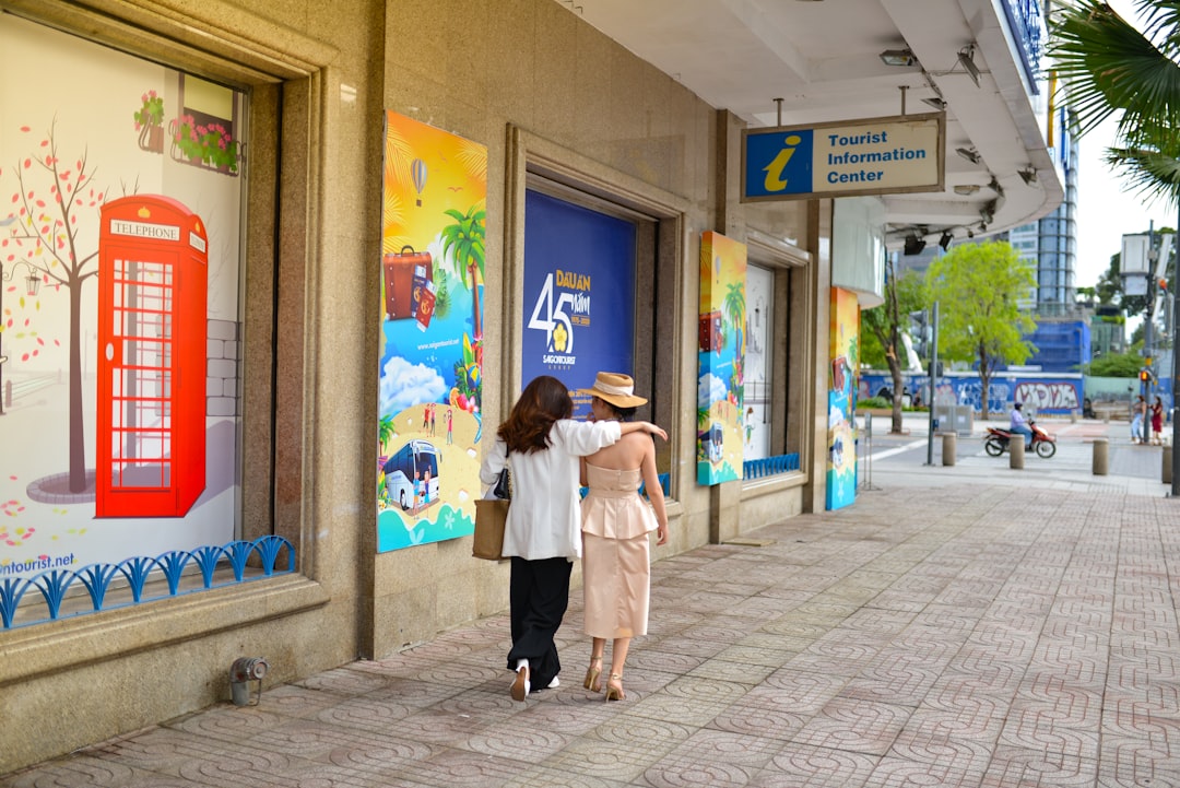 a couple of people that are walking down a sidewalk