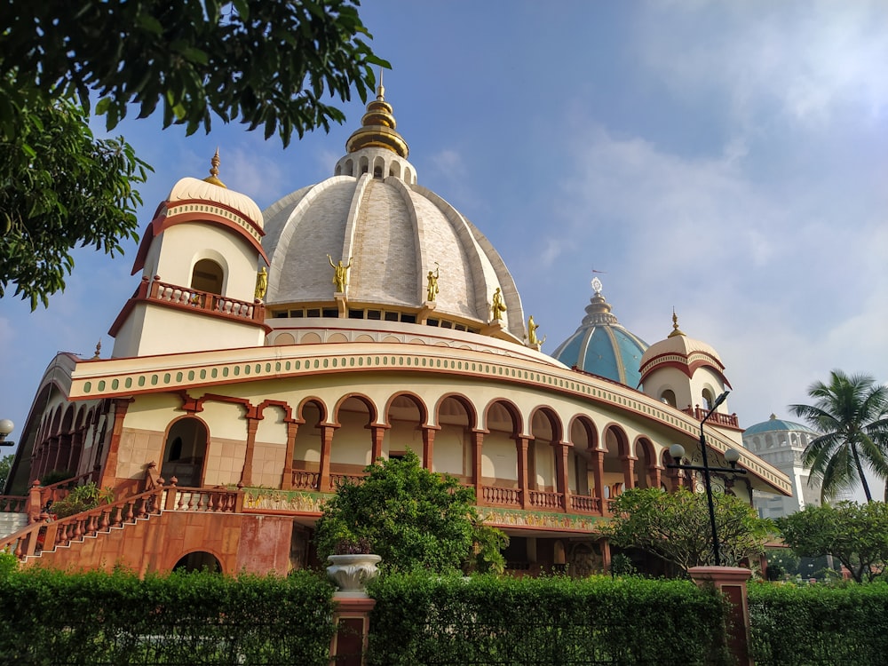 a white and brown building with a large dome on top of it