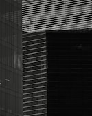 Abstract architectural detail emphasizing vertical lines and light.