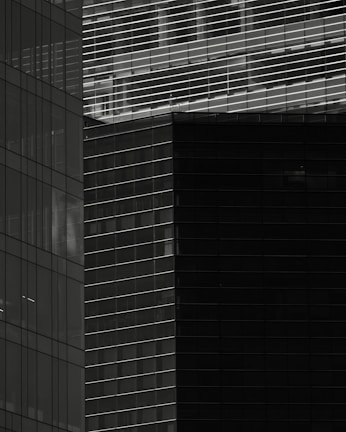 Abstract architectural detail emphasizing vertical lines and light.