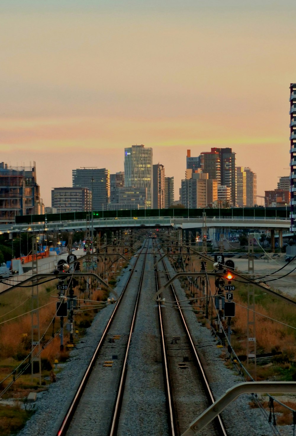 a train track with a city in the background