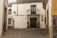 Cozy Andalusian apartment with traditional marble columns and wooden beams.