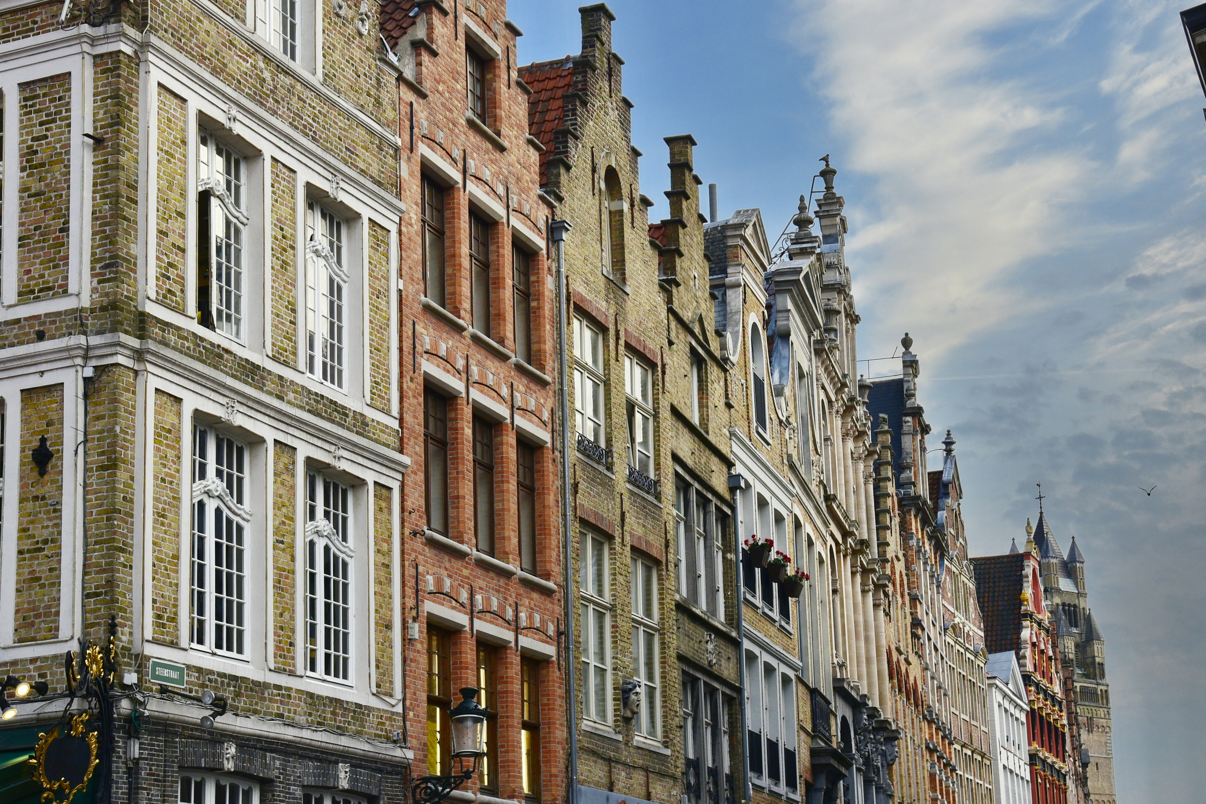 a row of brick buildings on a city street