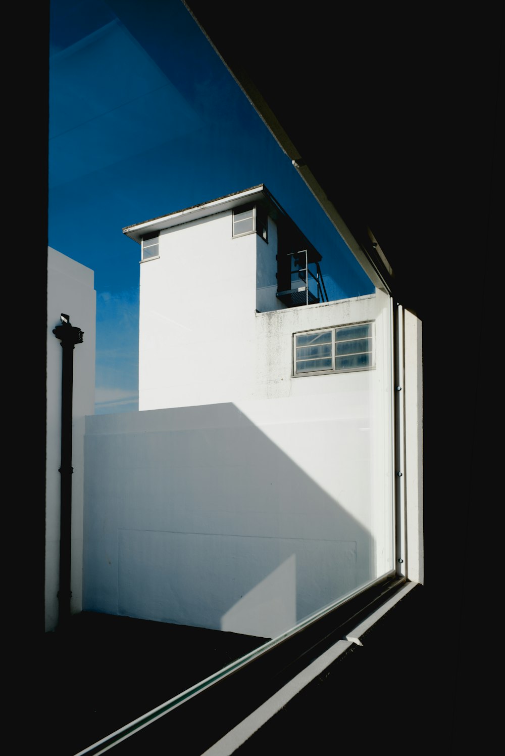 a white building with a blue sky in the background