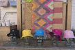 Cozy display of colorful accessories like bags and hats with artistic prints