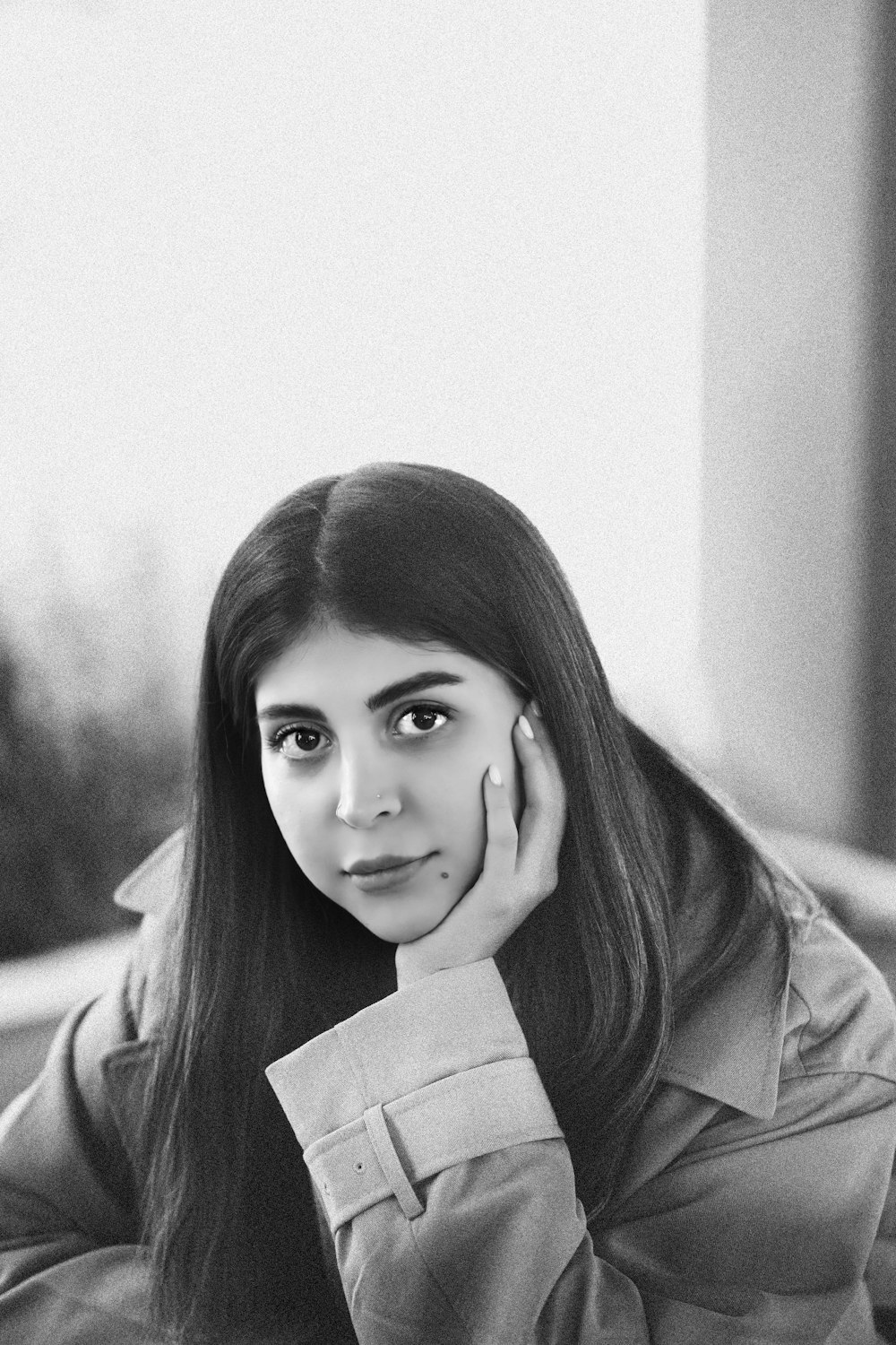 a black and white photo of a woman with long hair