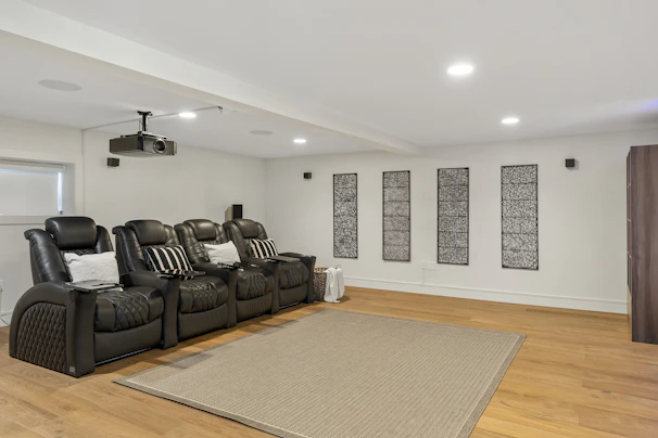 A cozy Indian living room with a Toppro projector displaying a colorful movie on a large wall screen.