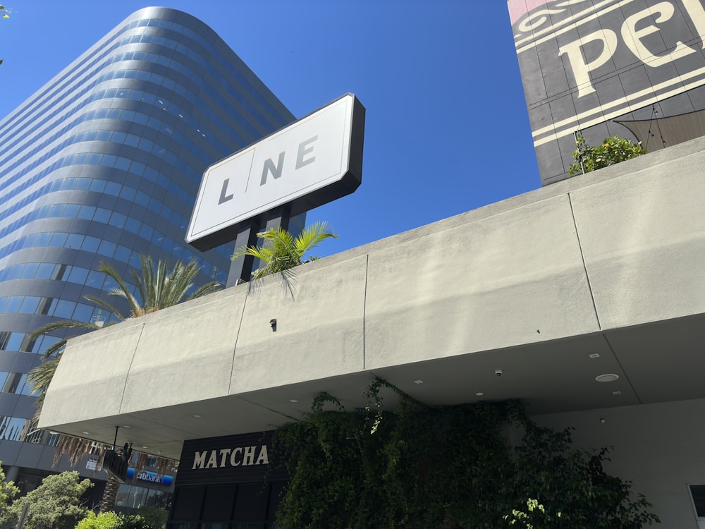 a tall building with a sign on top of it