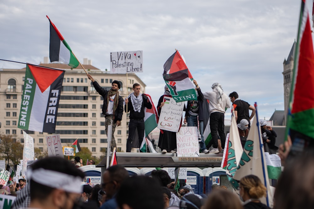 a group of people standing on top of a wooden platform