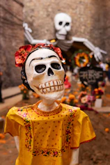 a statue of a woman with a skull on her head
