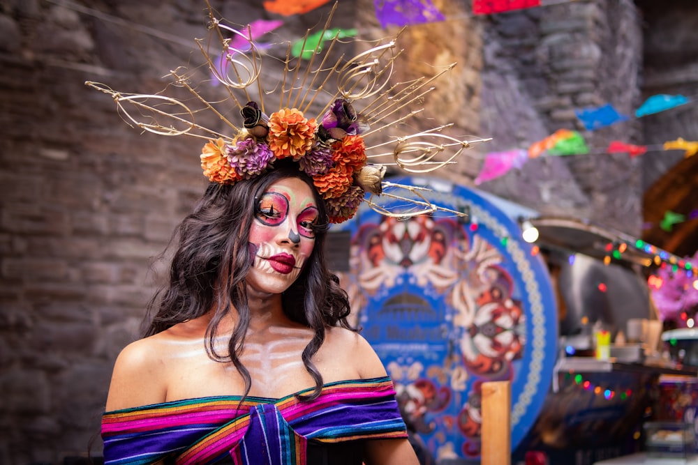 a woman in a colorful costume with feathers on her head