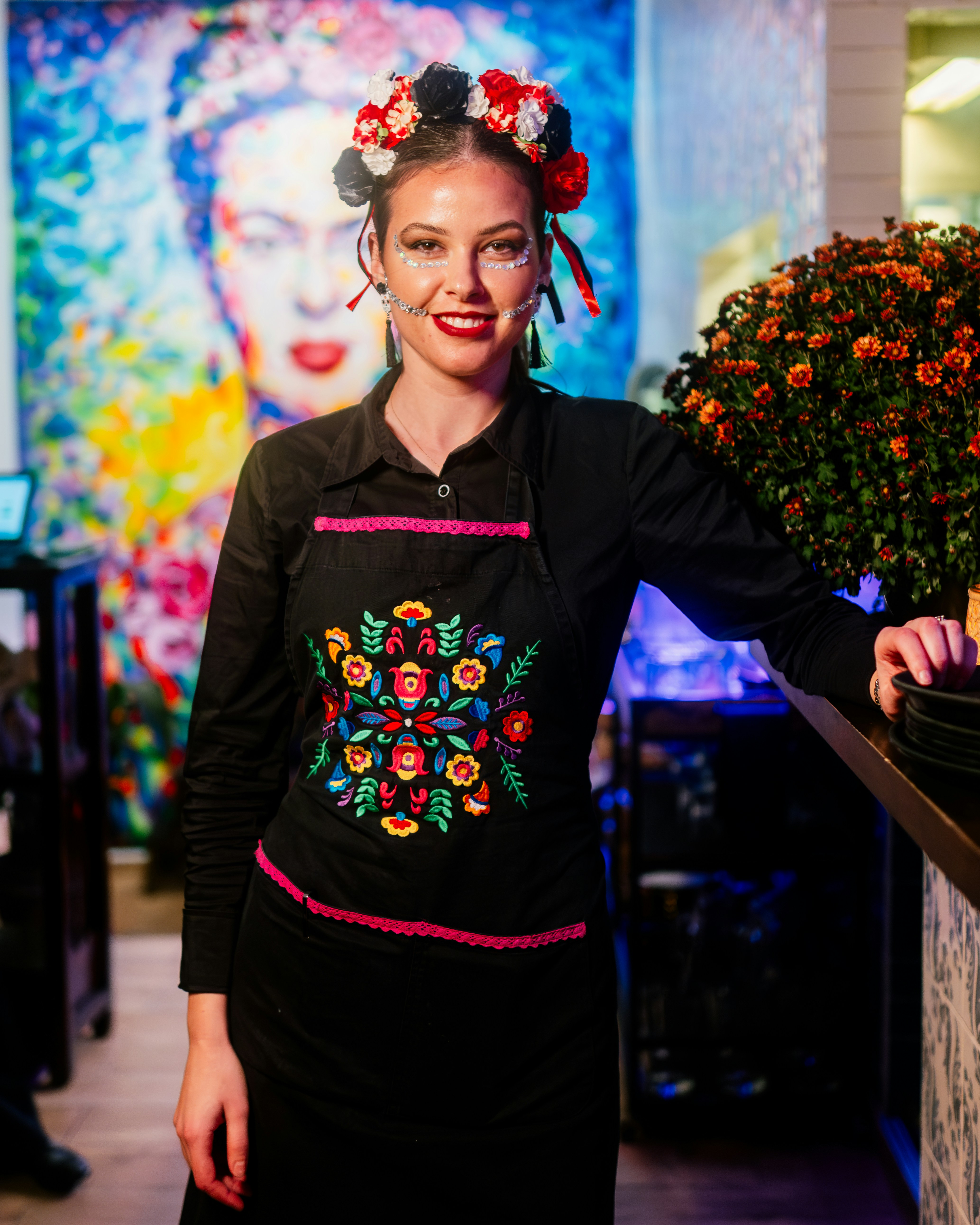 A woman in a black dress with a flower in her hair photo – Free Woman ...