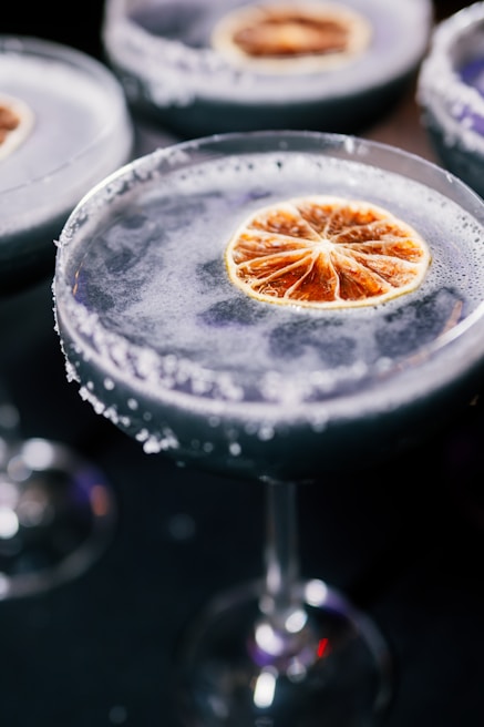 Close-up of a colorful cocktail being served at Aluvipub bar