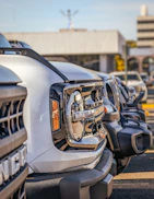 a row of parked cars in a parking lot