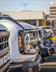 a row of parked cars in a parking lot