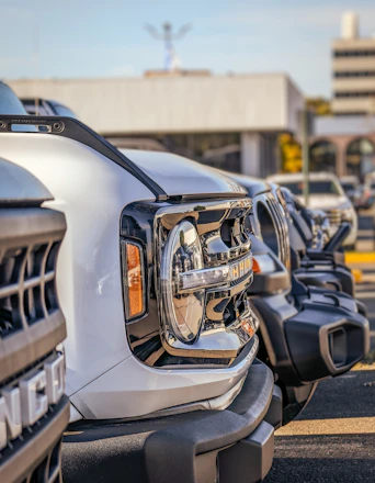 a row of parked cars in a parking lot