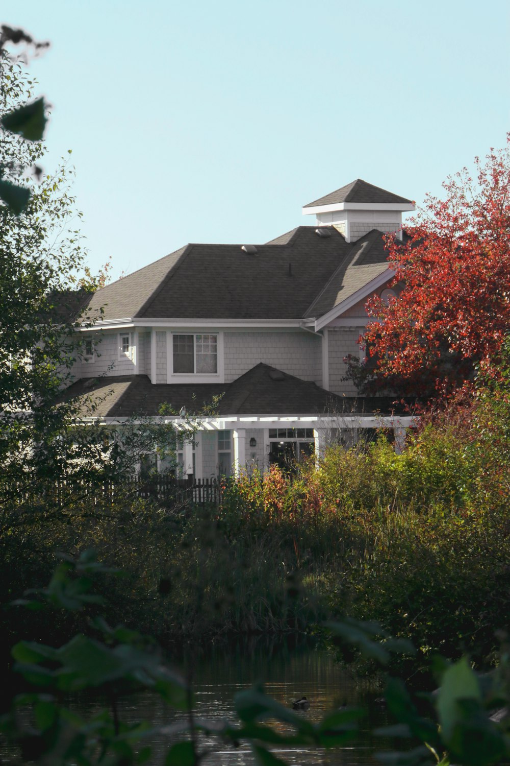 a large house with a clock tower on top of it