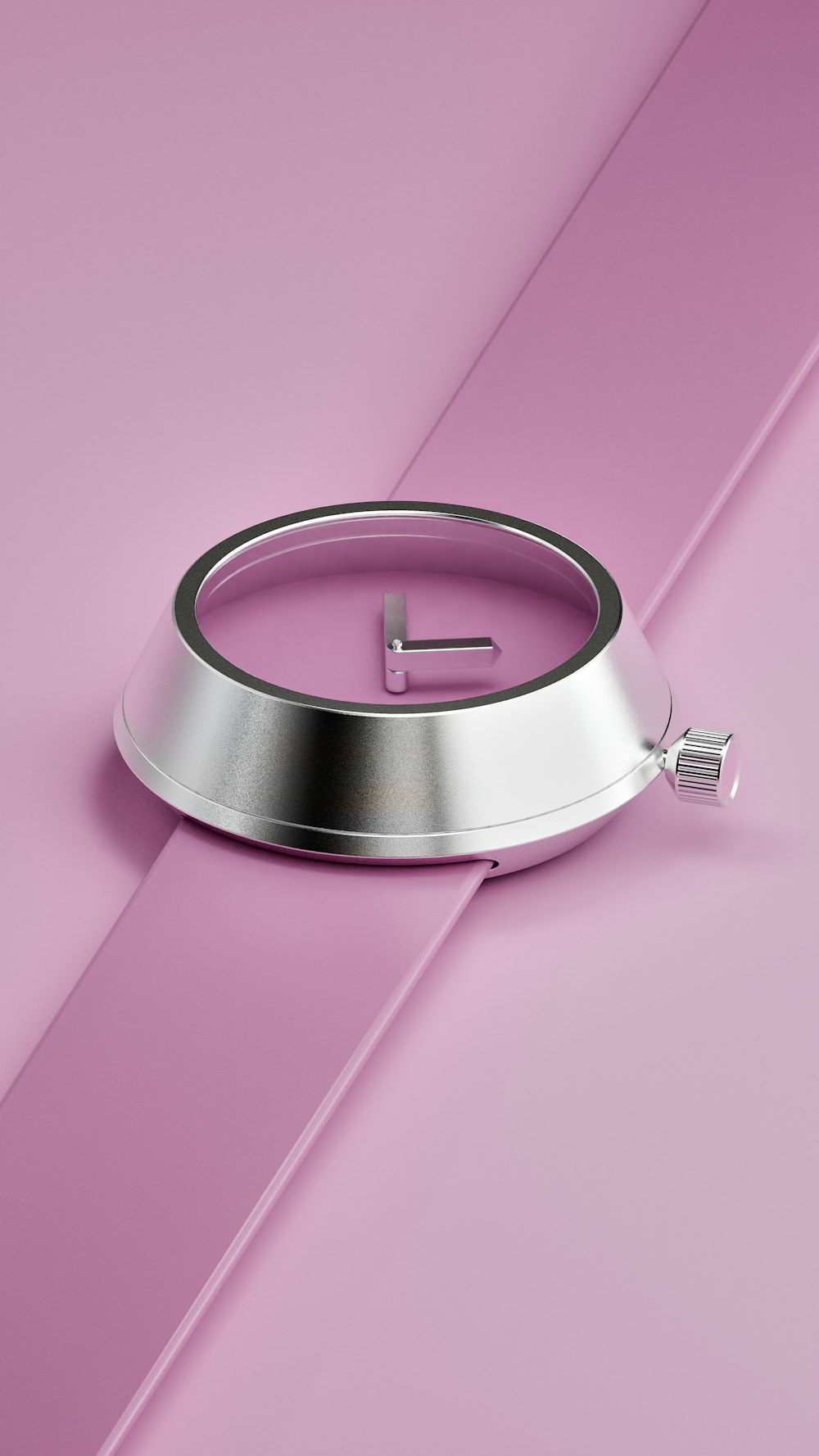 a metal object on a pink background