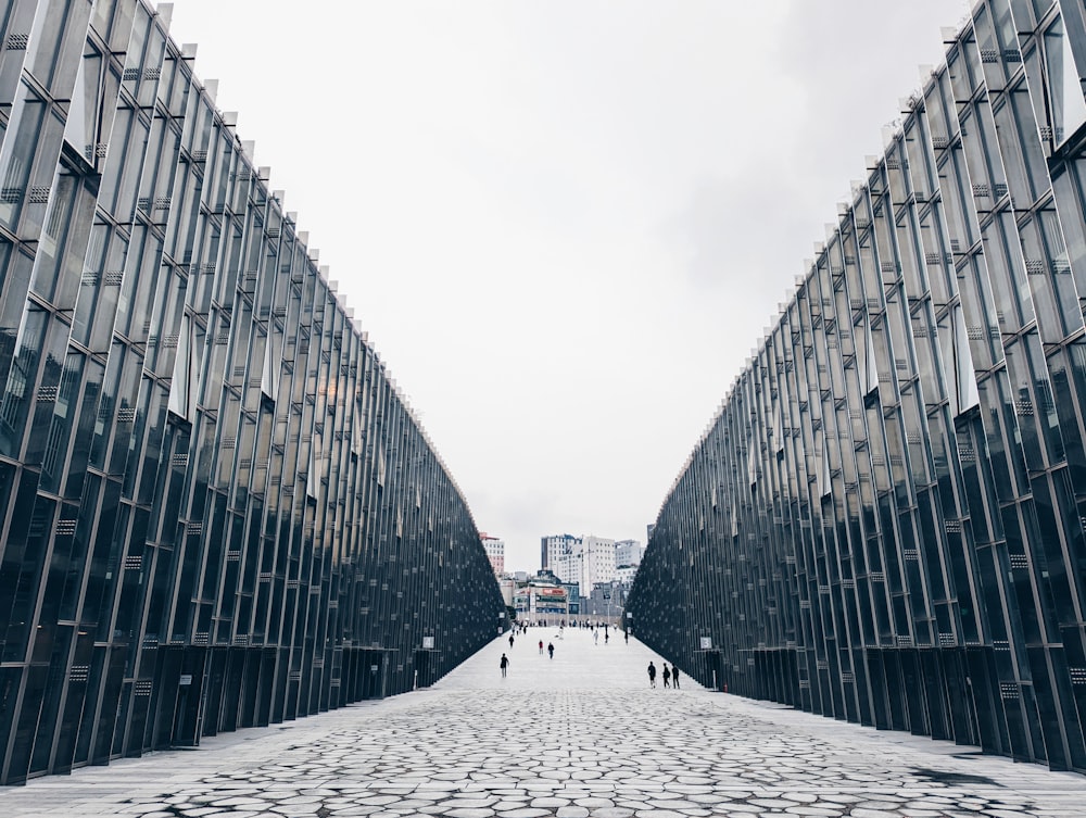 a couple of people that are standing in front of a building