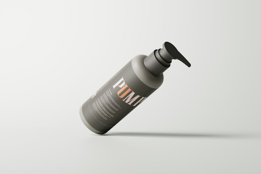 a gray bottle with a black cap on a white background