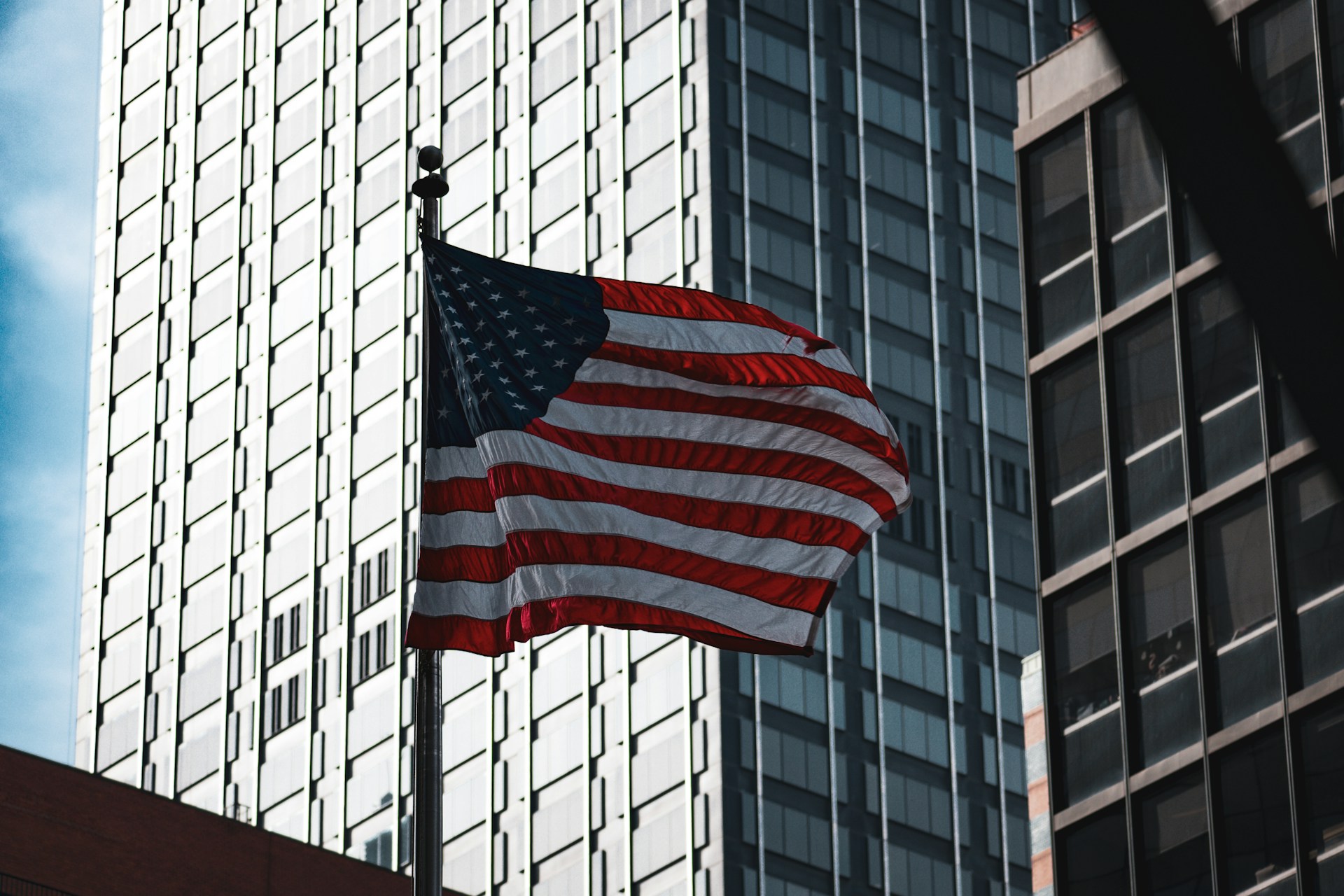 woman wearing yellow long-sleeved dress under white clouds and blue sky during daytime