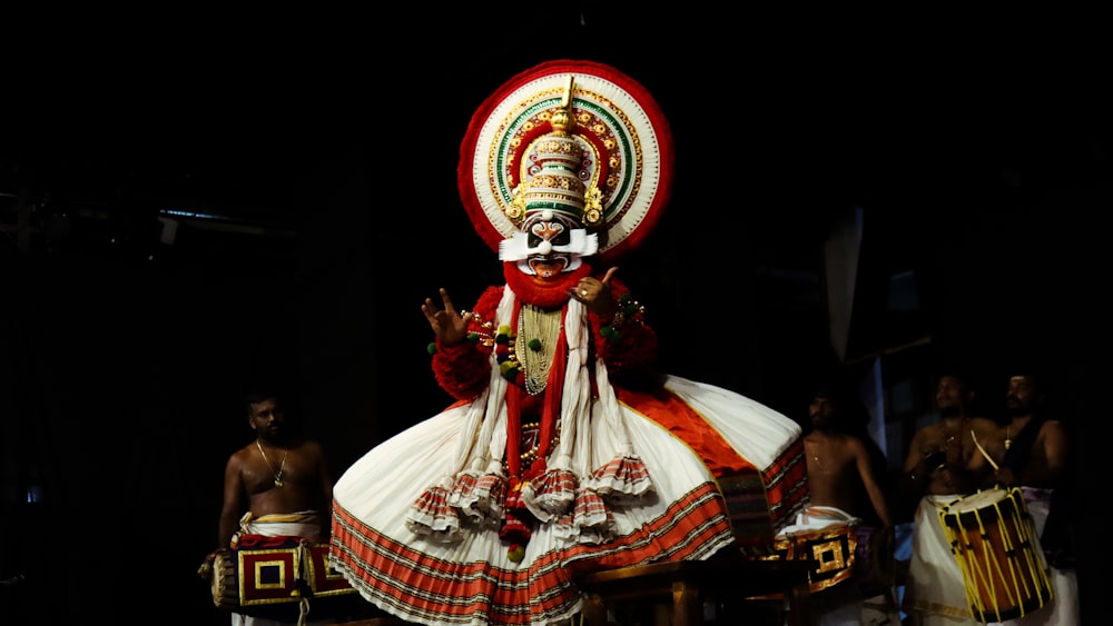 a person dressed in a costume and headdress